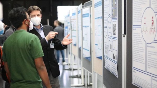 Participants from industry and research during the poster session at THI