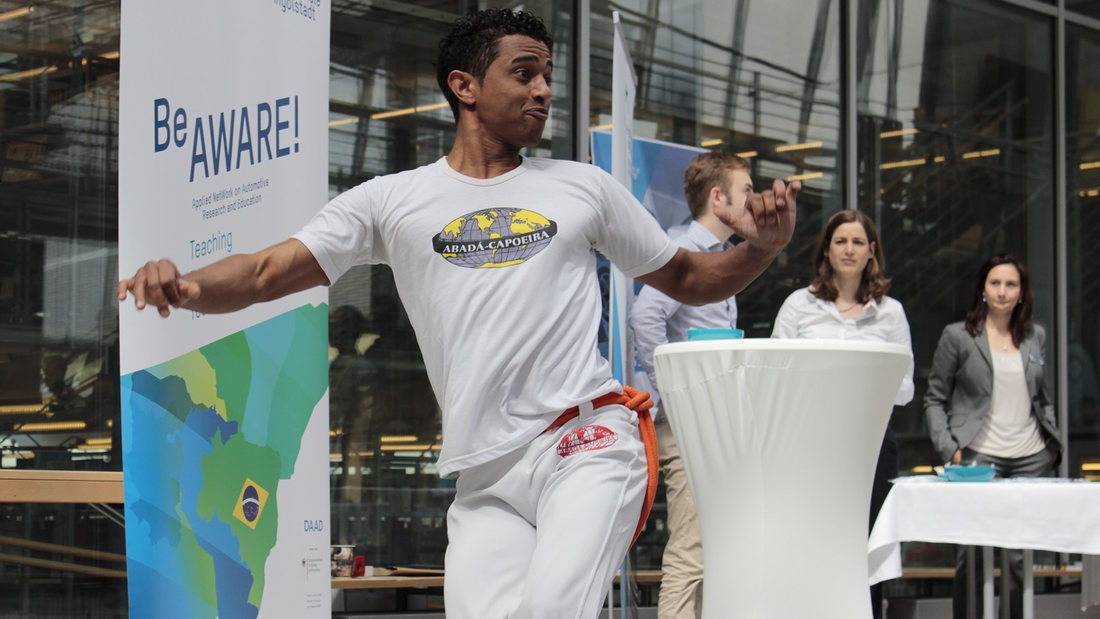 The picture shows a Capoeira dancer 