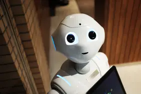 Abbildung eines kleinen Roboters mit freundlichem Gesicht